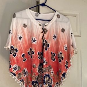 Very sweet pull over Shirt butterfly sleeves ties in front. You will love it.